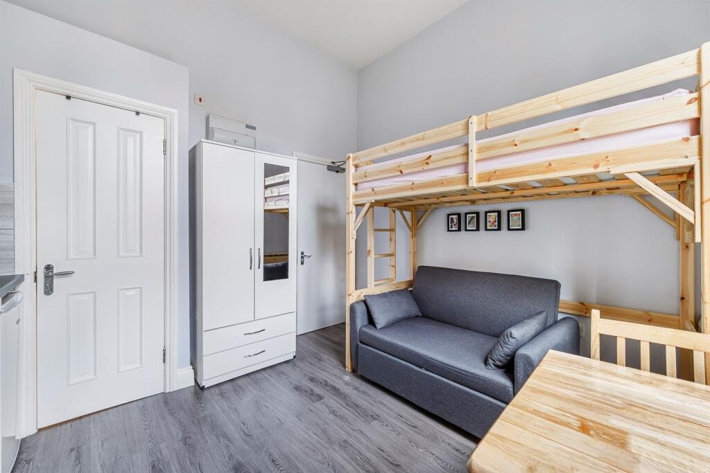 A cramped Kensington studio with a bunk bed over a sofa and a kitchenette just inches away is renting for £1,400 a month, with all bills and a £30 water charge extra.