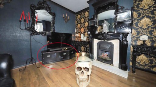 A £300,000 Bilston home has gone viral for its gothic décor featuring black walls, skulls, and a coffin used as a TV stand, offering a spooky twist on suburban living.