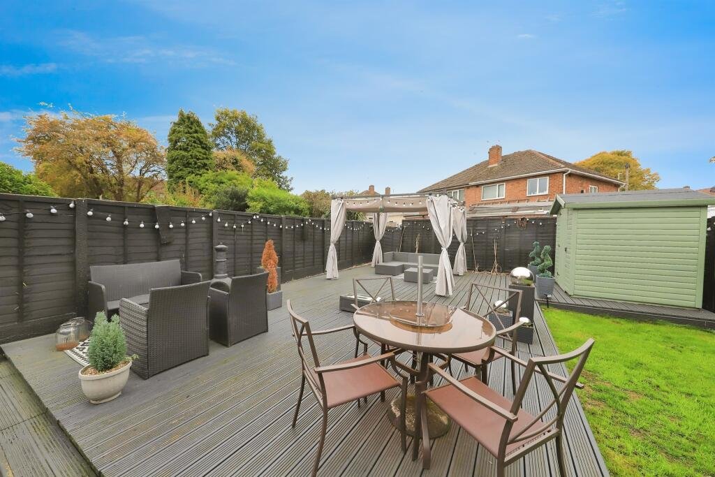 A £300,000 Bilston home has gone viral for its gothic décor featuring black walls, skulls, and a coffin used as a TV stand, offering a spooky twist on suburban living.