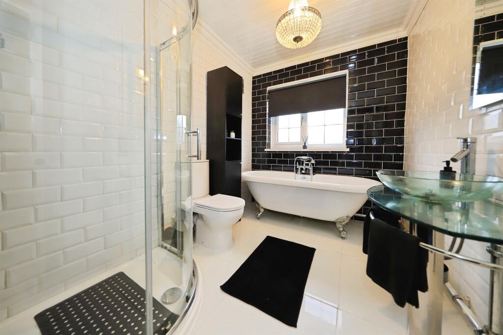 A £300,000 Bilston home has gone viral for its gothic décor featuring black walls, skulls, and a coffin used as a TV stand, offering a spooky twist on suburban living.