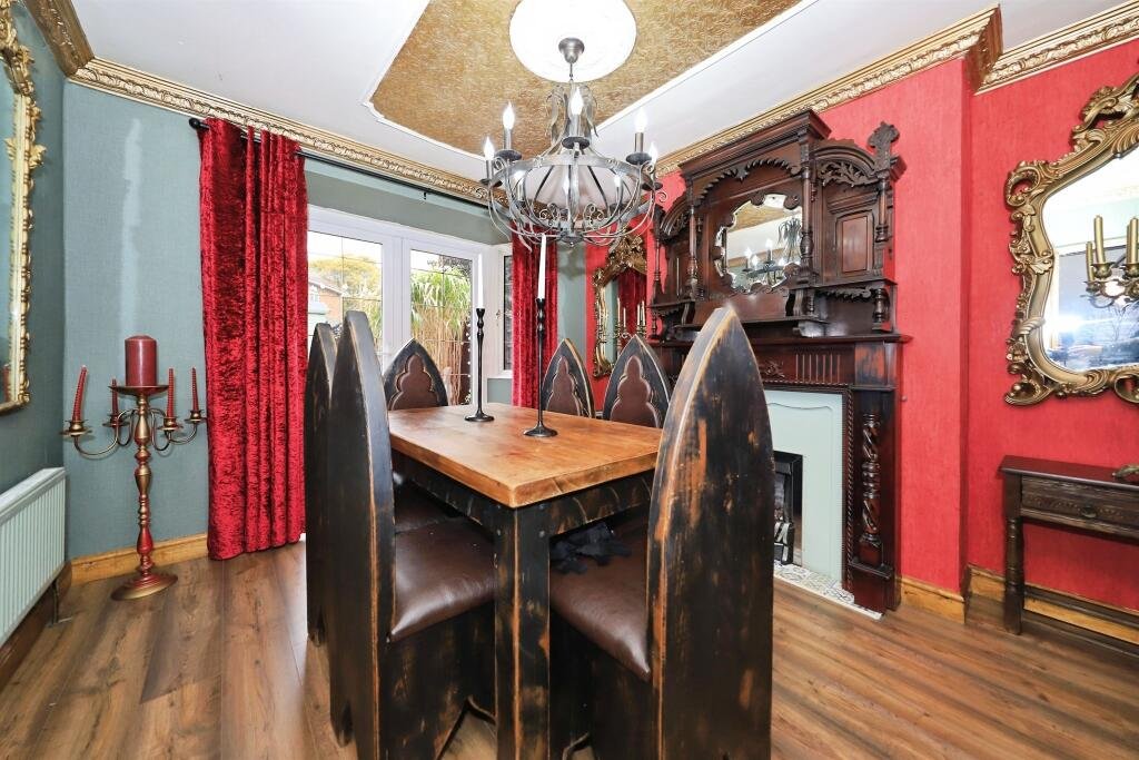 A £300,000 Bilston home has gone viral for its gothic décor featuring black walls, skulls, and a coffin used as a TV stand, offering a spooky twist on suburban living.