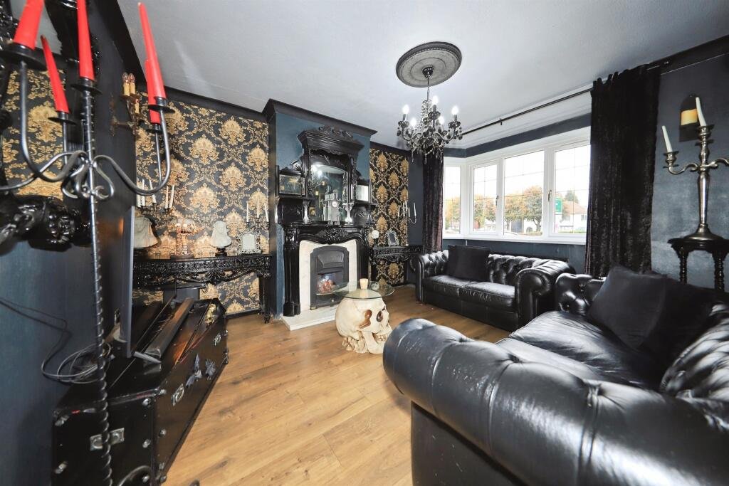 A £300,000 Bilston home has gone viral for its gothic décor featuring black walls, skulls, and a coffin used as a TV stand, offering a spooky twist on suburban living.
