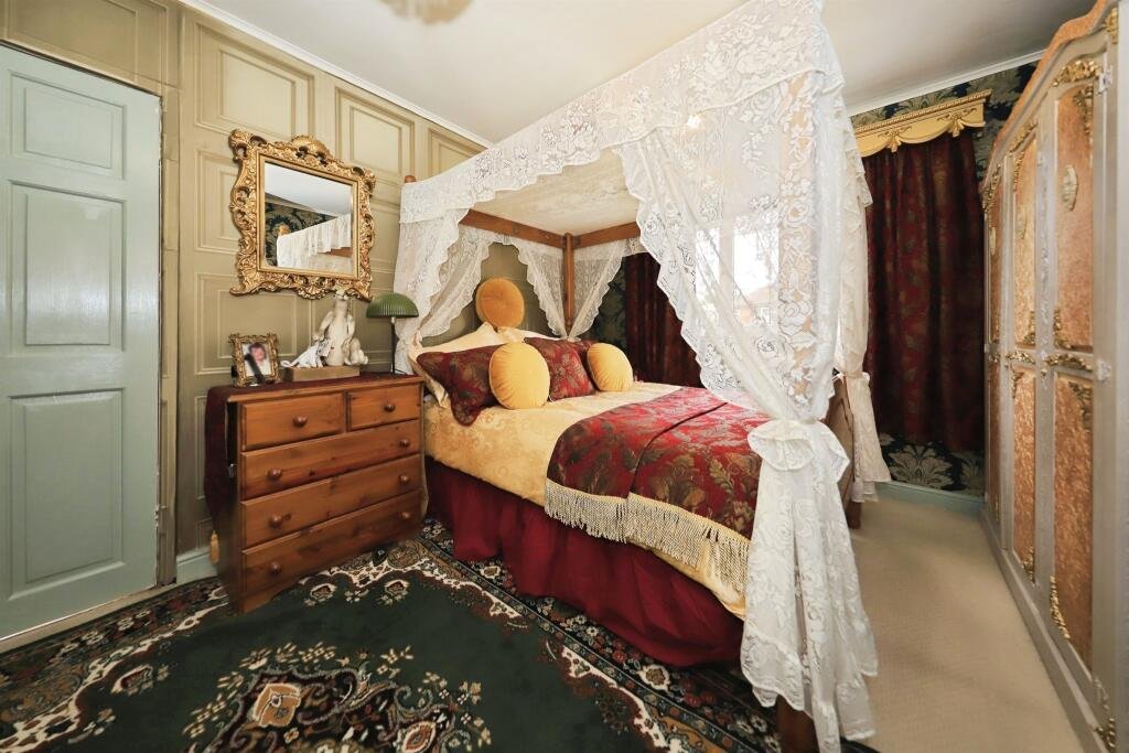 A £300,000 Bilston home has gone viral for its gothic décor featuring black walls, skulls, and a coffin used as a TV stand, offering a spooky twist on suburban living.