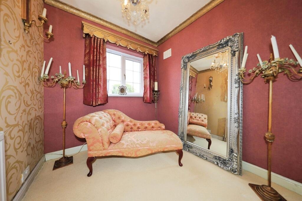 A £300,000 Bilston home has gone viral for its gothic décor featuring black walls, skulls, and a coffin used as a TV stand, offering a spooky twist on suburban living.