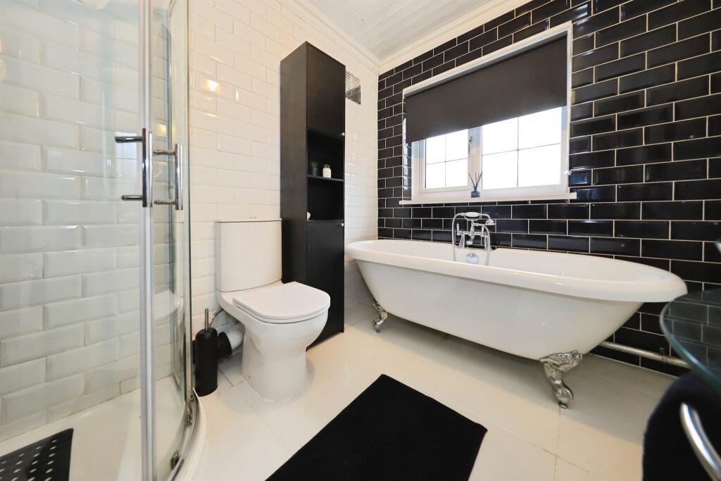 A £300,000 Bilston home has gone viral for its gothic décor featuring black walls, skulls, and a coffin used as a TV stand, offering a spooky twist on suburban living.