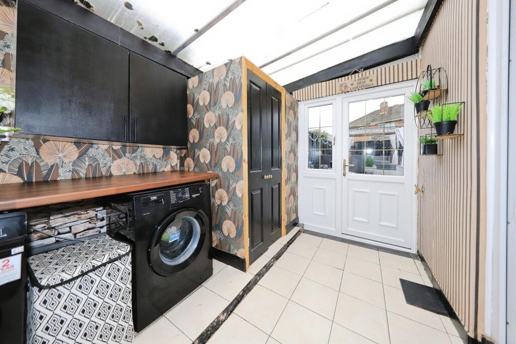 A £300,000 Bilston home has gone viral for its gothic décor featuring black walls, skulls, and a coffin used as a TV stand, offering a spooky twist on suburban living.