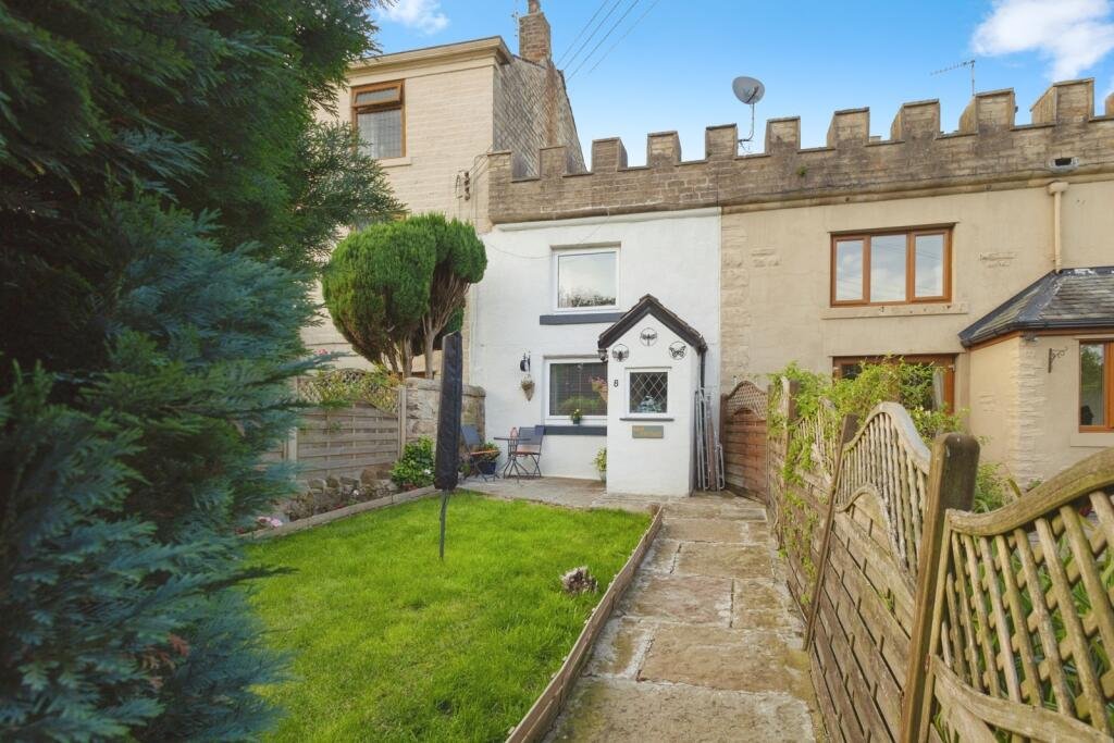A 200 year old Rose Cottage within castle grounds in Bury is for sale at 250000 pounds offering two bedrooms cosy charm gardens parking and a unique semi rural setting today.