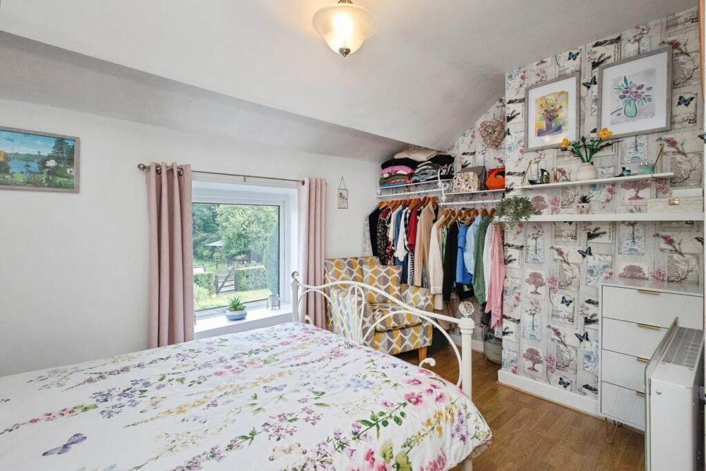 A 200 year old Rose Cottage within castle grounds in Bury is for sale at 250000 pounds offering two bedrooms cosy charm gardens parking and a unique semi rural setting today.
