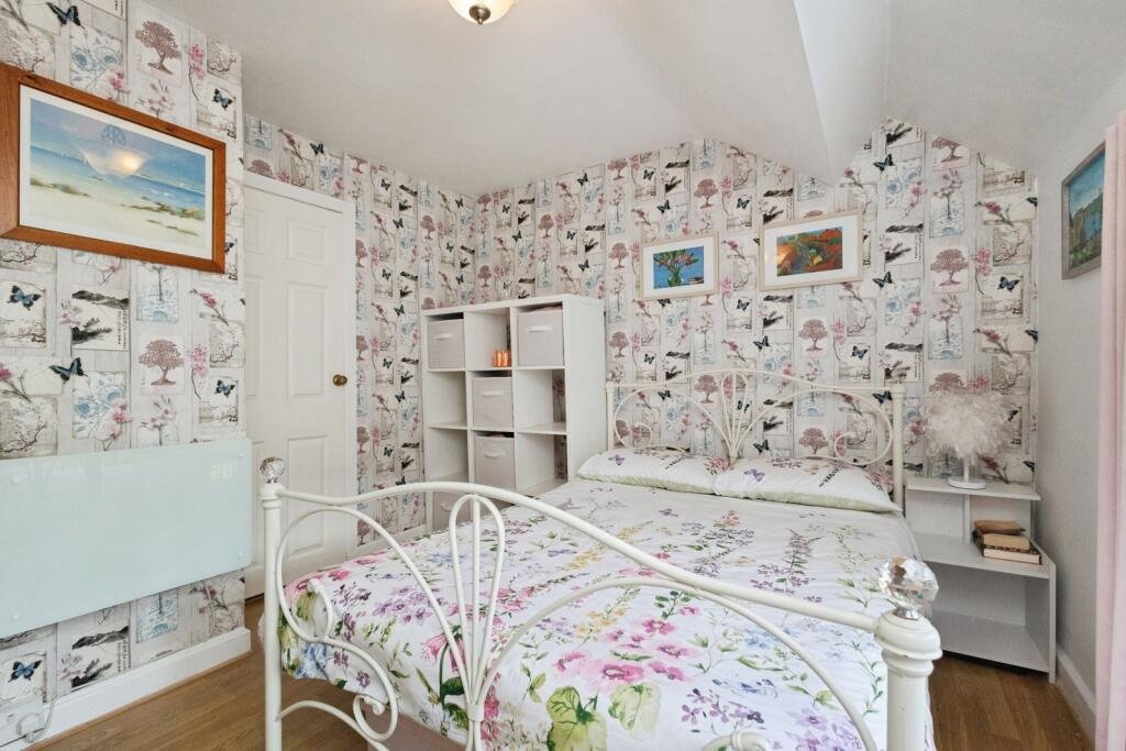 A 200 year old Rose Cottage within castle grounds in Bury is for sale at 250000 pounds offering two bedrooms cosy charm gardens parking and a unique semi rural setting today.