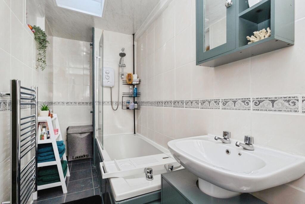 A 200 year old Rose Cottage within castle grounds in Bury is for sale at 250000 pounds offering two bedrooms cosy charm gardens parking and a unique semi rural setting today.