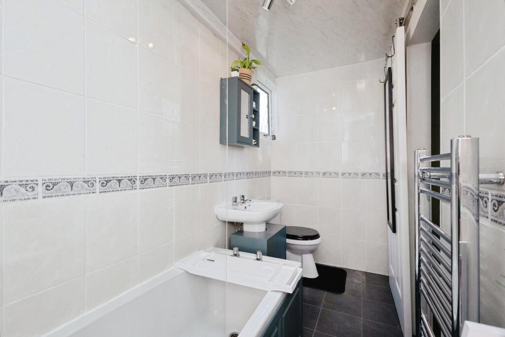 A 200 year old Rose Cottage within castle grounds in Bury is for sale at 250000 pounds offering two bedrooms cosy charm gardens parking and a unique semi rural setting today.