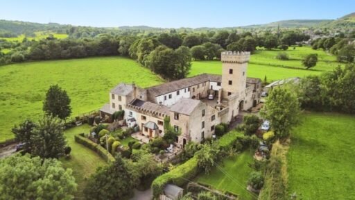 A 200 year old Rose Cottage within castle grounds in Bury is for sale at 250000 pounds offering two bedrooms cosy charm gardens parking and a unique semi rural setting today.