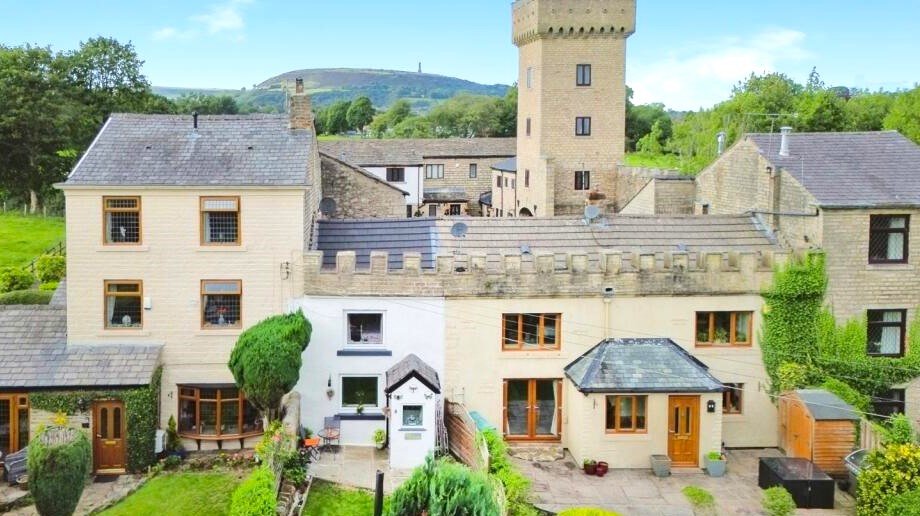 A 200 year old Rose Cottage within castle grounds in Bury is for sale at 250000 pounds offering two bedrooms cosy charm gardens parking and a unique semi rural setting today.