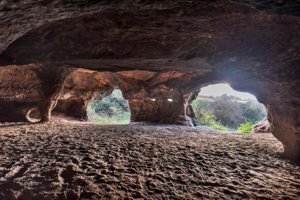 A 7.5 acre plot with hidden 500 year old Frodsham Caves is up for auction for 55000 offering a rare chance to own a mysterious underground sandstone cave network.