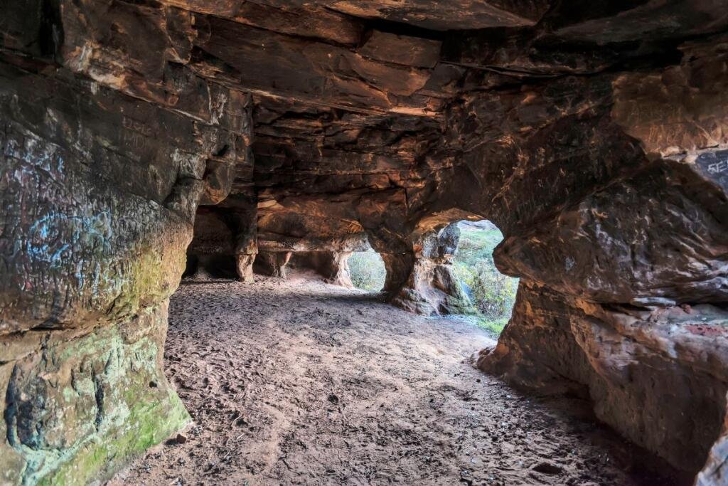 A 7.5 acre plot with hidden 500 year old Frodsham Caves is up for auction for 55000 offering a rare chance to own a mysterious underground sandstone cave network.