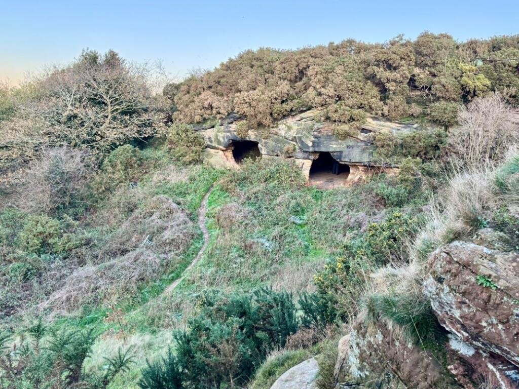 A 7.5 acre plot with hidden 500 year old Frodsham Caves is up for auction for 55000 offering a rare chance to own a mysterious underground sandstone cave network.