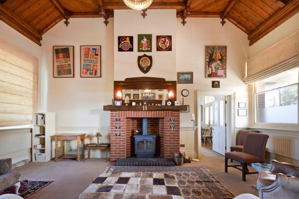 A former railway station once used by King Edward VII is for sale at £750000 offering three ensuite bedrooms original platform royal history and over an acre of landscaped grounds.