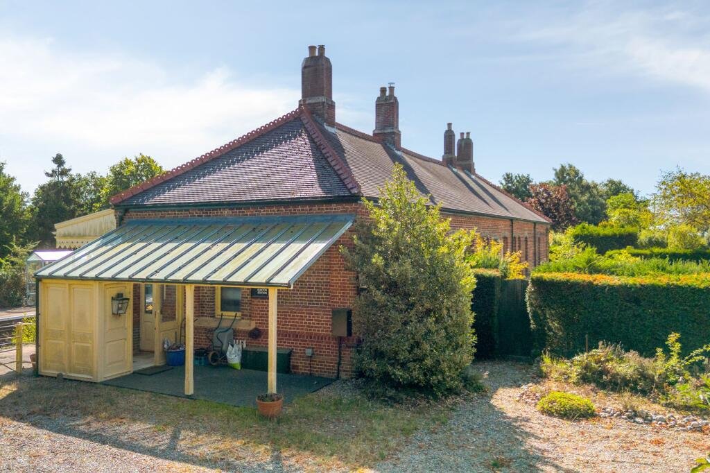 A former railway station once used by King Edward VII is for sale at £750000 offering three ensuite bedrooms original platform royal history and over an acre of landscaped grounds.