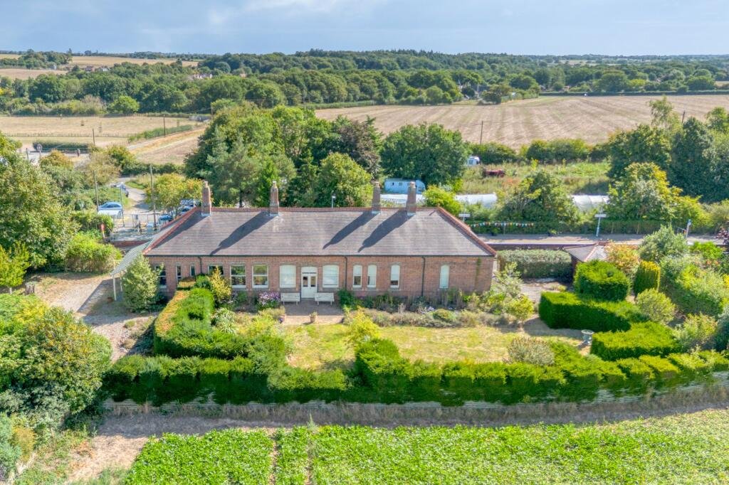 A former railway station once used by King Edward VII is for sale at £750000 offering three ensuite bedrooms original platform royal history and over an acre of landscaped grounds.