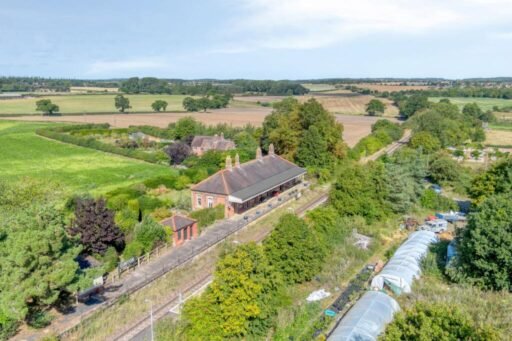 A former railway station once used by King Edward VII is for sale at £750000 offering three ensuite bedrooms original platform royal history and over an acre of landscaped grounds.