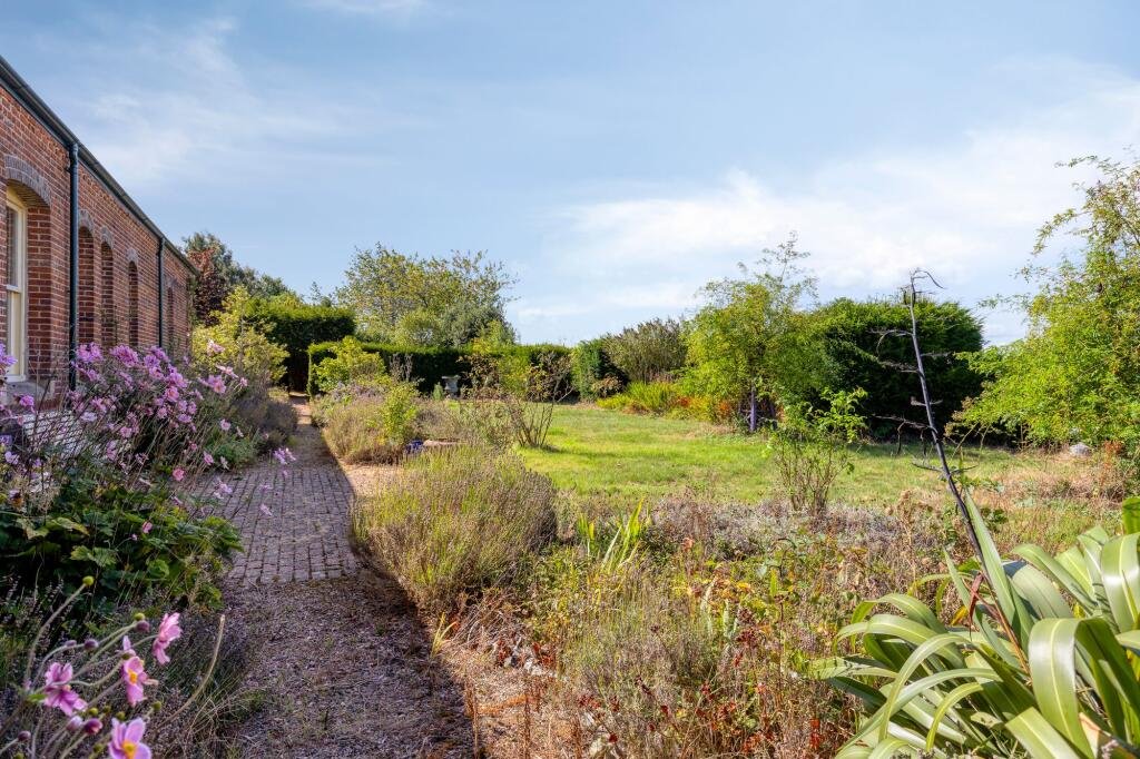 A former railway station once used by King Edward VII is for sale at £750000 offering three ensuite bedrooms original platform royal history and over an acre of landscaped grounds.