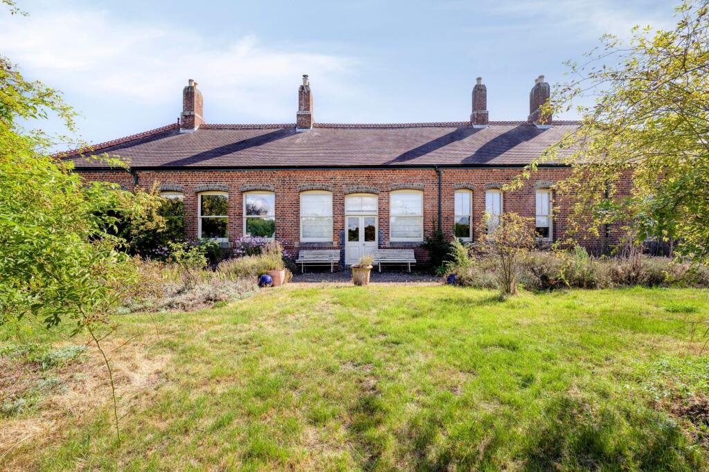 A former railway station once used by King Edward VII is for sale at £750000 offering three ensuite bedrooms original platform royal history and over an acre of landscaped grounds.