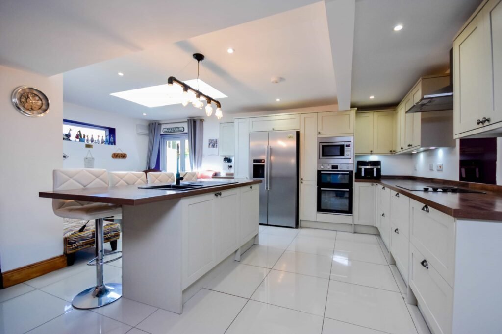 A quirky 1824 cottage in Penkhull priced at 410000 pounds features exposed beams modern spaces and a restored glass covered water well offering rare historic charm today.