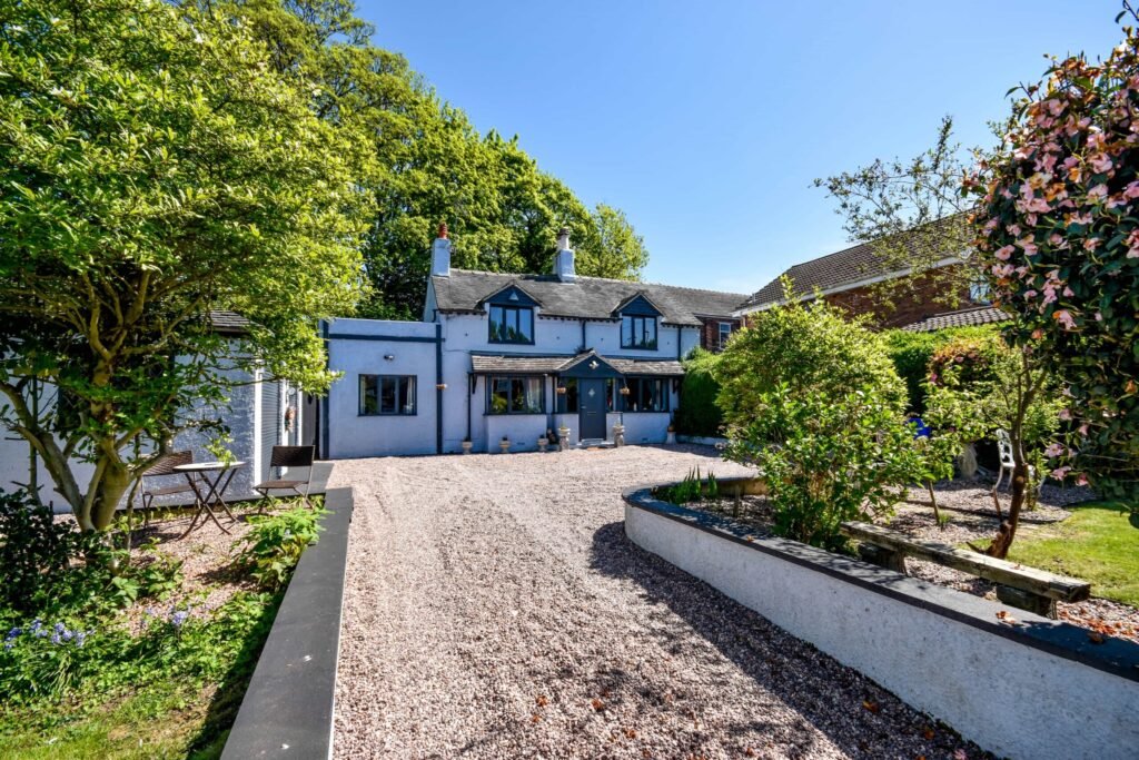 A quirky 1824 cottage in Penkhull priced at 410000 pounds features exposed beams modern spaces and a restored glass covered water well offering rare historic charm today.