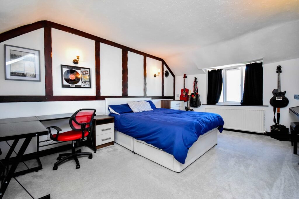 A quirky 1824 cottage in Penkhull priced at 410000 pounds features exposed beams modern spaces and a restored glass covered water well offering rare historic charm today.