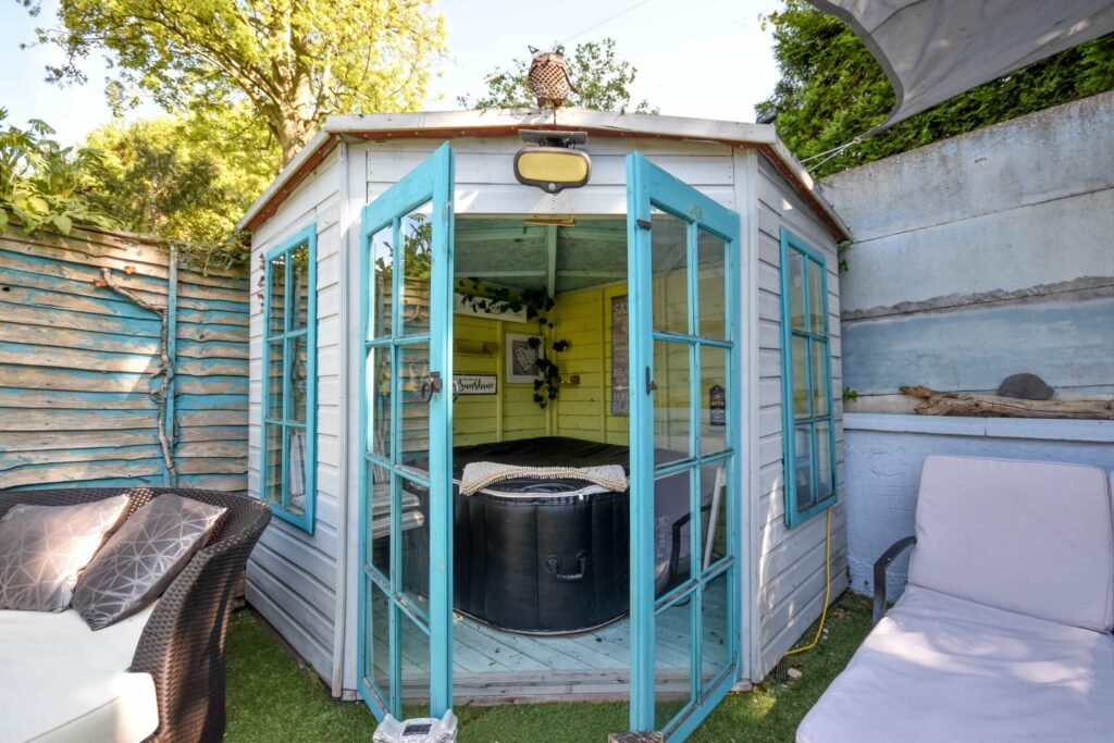 A quirky 1824 cottage in Penkhull priced at 410000 pounds features exposed beams modern spaces and a restored glass covered water well offering rare historic charm today.