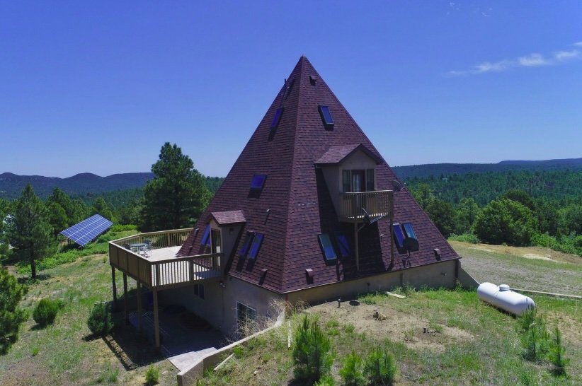 A £572,000 pyramid-shaped Colorado home with a secret bunker, escape hatch, solar power and 150 food cans is up for sale, offering complete off-grid security.
