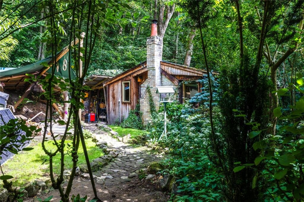 A £125,000 off-grid log cabin in Northumberland offers solar power, 5G internet and woodland views, but the new owner must move out for one week every year at Christmas.