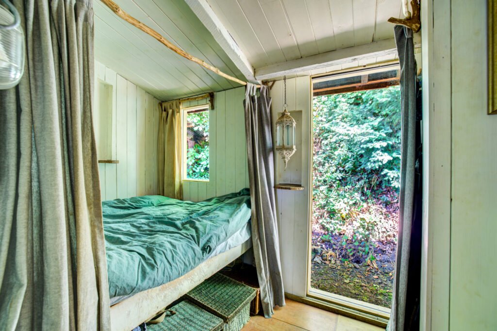 A £125,000 off-grid log cabin in Northumberland offers solar power, 5G internet and woodland views, but the new owner must move out for one week every year at Christmas.