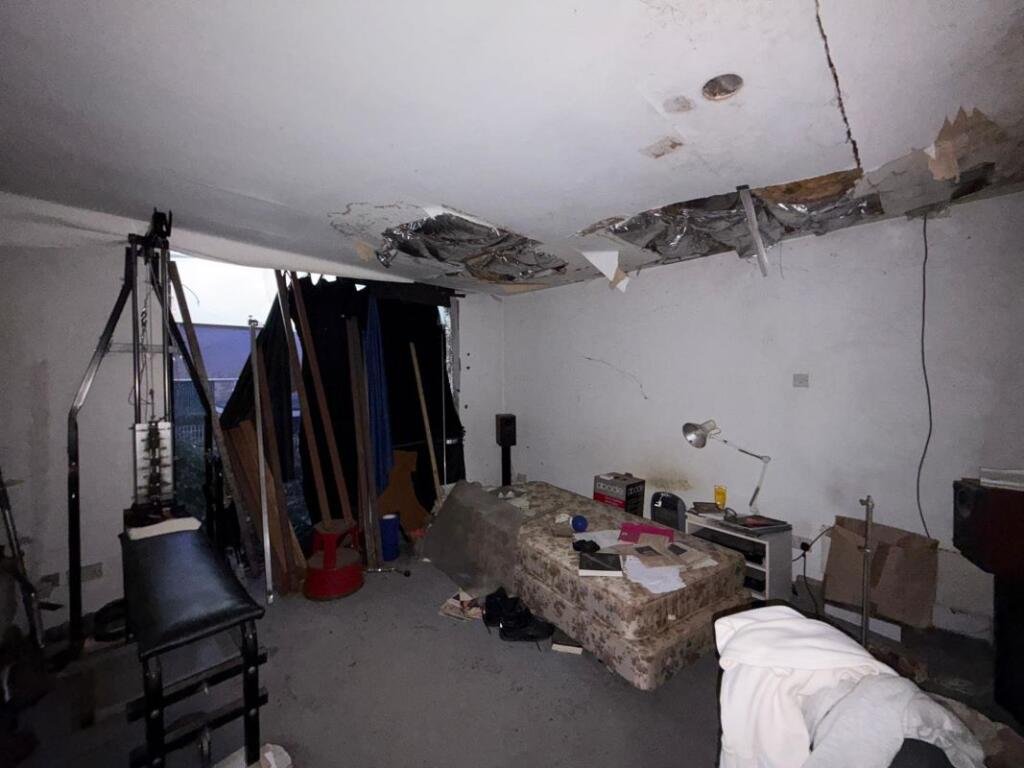 Overgrown Camden Mews home with collapsing interiors and a hidden car is listed for 925k promising redevelopment potential despite its rundown state and stunned locals.