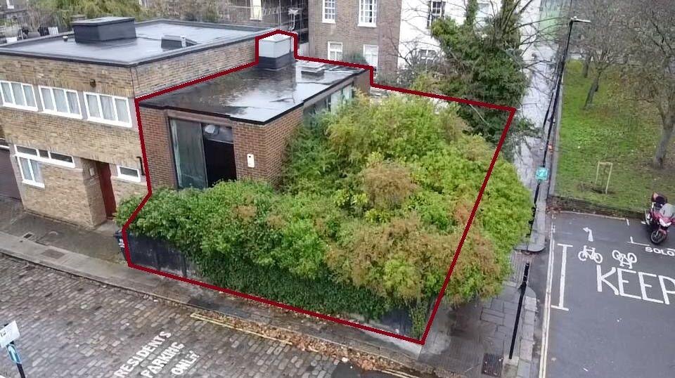 Overgrown Camden Mews home with collapsing interiors and a hidden car is listed for 925k promising redevelopment potential despite its rundown state and stunned locals.
