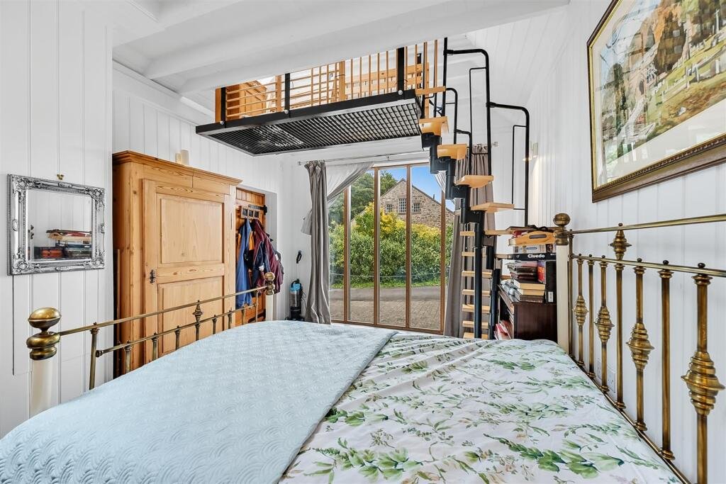 A tiny stone home in Wirksworth priced at 225000 pounds sparks debate as its shed like look contrasts with its modern interior parking space and holiday let potential today.