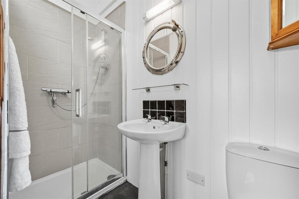 A tiny stone home in Wirksworth priced at 225000 pounds sparks debate as its shed like look contrasts with its modern interior parking space and holiday let potential today.