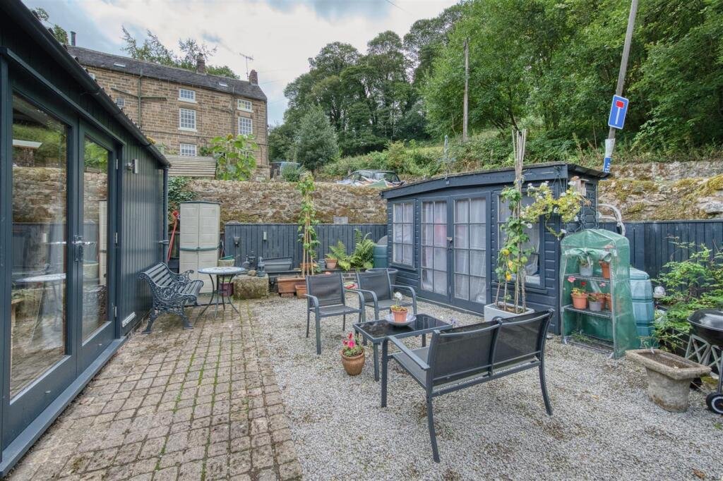 A tiny stone home in Wirksworth priced at 225000 pounds sparks debate as its shed like look contrasts with its modern interior parking space and holiday let potential today.