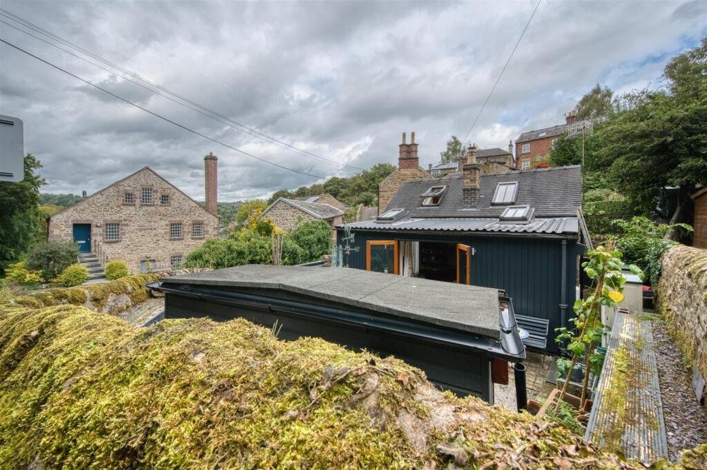 A tiny stone home in Wirksworth priced at 225000 pounds sparks debate as its shed like look contrasts with its modern interior parking space and holiday let potential today.