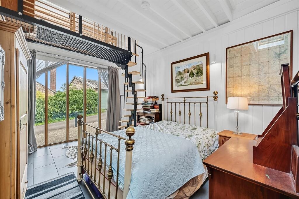 A tiny stone home in Wirksworth priced at 225000 pounds sparks debate as its shed like look contrasts with its modern interior parking space and holiday let potential today.