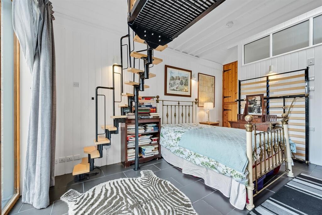 A tiny stone home in Wirksworth priced at 225000 pounds sparks debate as its shed like look contrasts with its modern interior parking space and holiday let potential today.