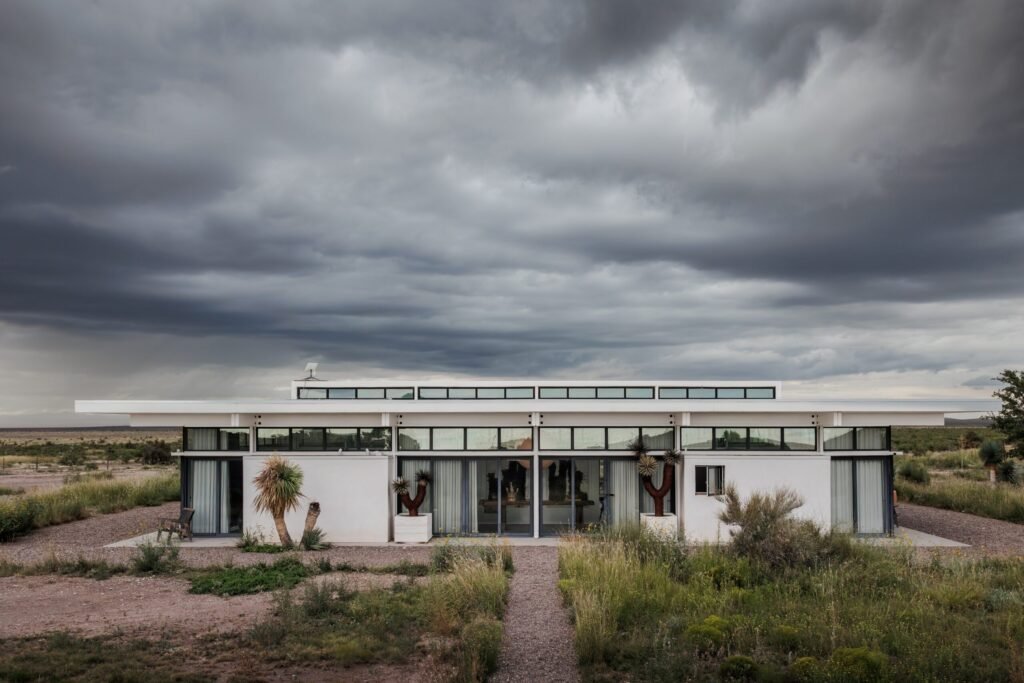 A £2.2m desert ranch near Marfa, Texas, once loved by A-listers, is for sale featuring stunning mountain views, modern design, and complete privacy on 10 acres.