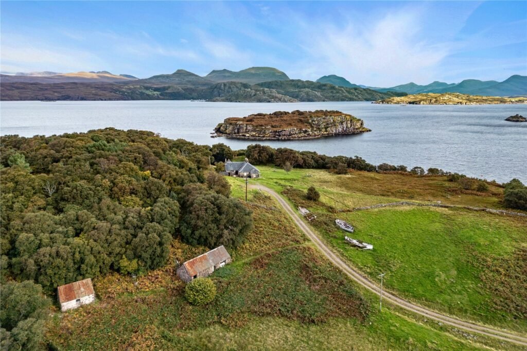 A four-bedroom stone cottage near Loch Torridon is for sale at £550,000, offering nine acres of land, rustic charm, and a private seven-acre island in the Scottish Highlands.