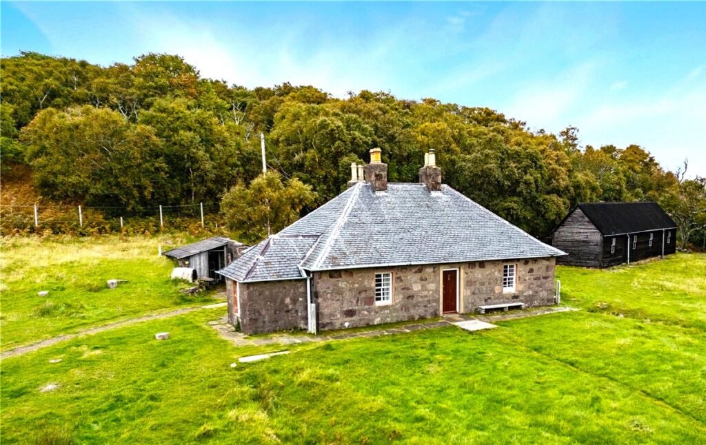 A four-bedroom stone cottage near Loch Torridon is for sale at £550,000, offering nine acres of land, rustic charm, and a private seven-acre island in the Scottish Highlands.