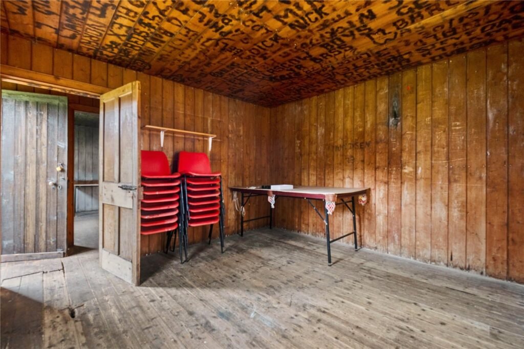 A four-bedroom stone cottage near Loch Torridon is for sale at £550,000, offering nine acres of land, rustic charm, and a private seven-acre island in the Scottish Highlands.