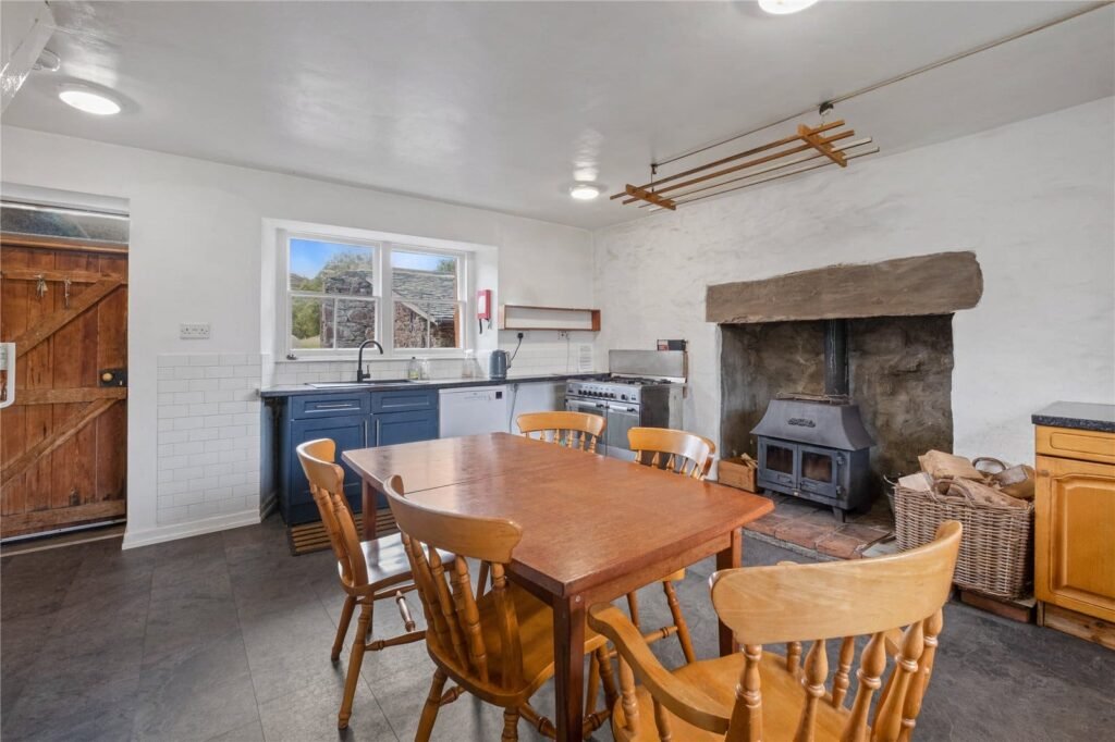 A four-bedroom stone cottage near Loch Torridon is for sale at £550,000, offering nine acres of land, rustic charm, and a private seven-acre island in the Scottish Highlands.