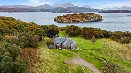 A four-bedroom stone cottage near Loch Torridon is for sale at £550,000, offering nine acres of land, rustic charm, and a private seven-acre island in the Scottish Highlands.
