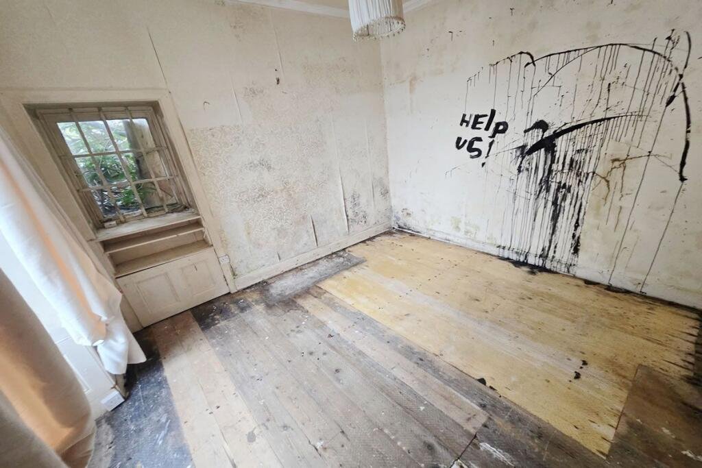 A three-bedroom seaside house near Glasgow is selling for just £60,000, but eerie graffiti reading Help us inside has made this so-called dream home a spooky bargain.