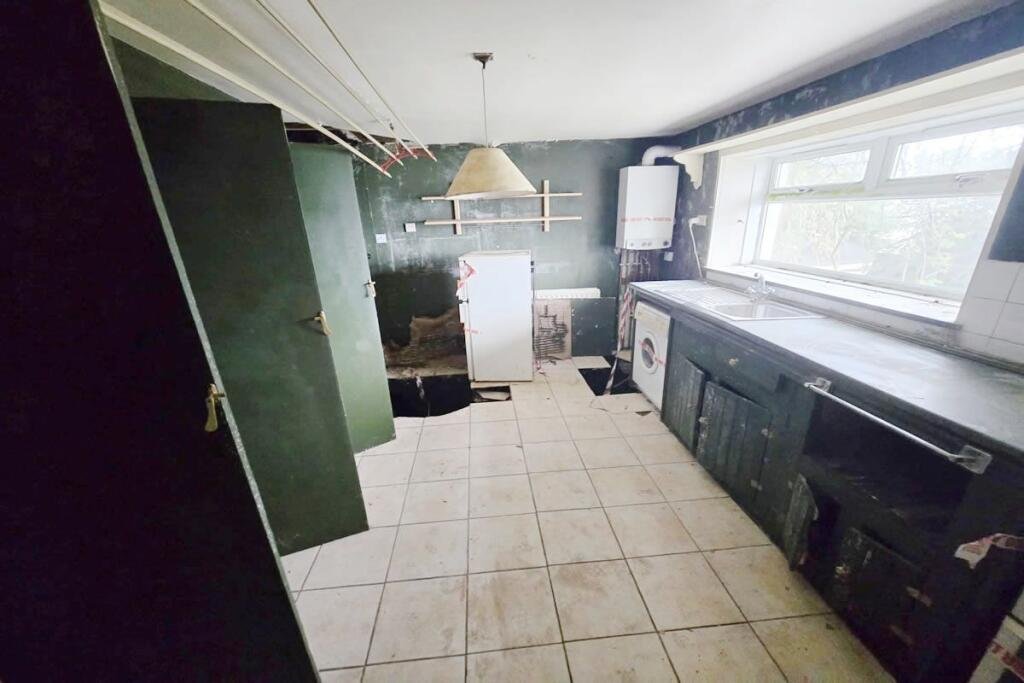 A three-bedroom seaside house near Glasgow is selling for just £60,000, but eerie graffiti reading Help us inside has made this so-called dream home a spooky bargain.