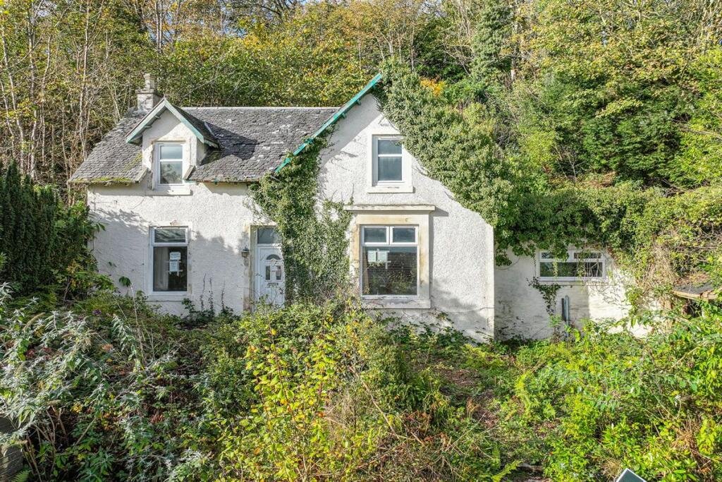 A three-bedroom seaside house near Glasgow is selling for just £60,000, but eerie graffiti reading Help us inside has made this so-called dream home a spooky bargain.